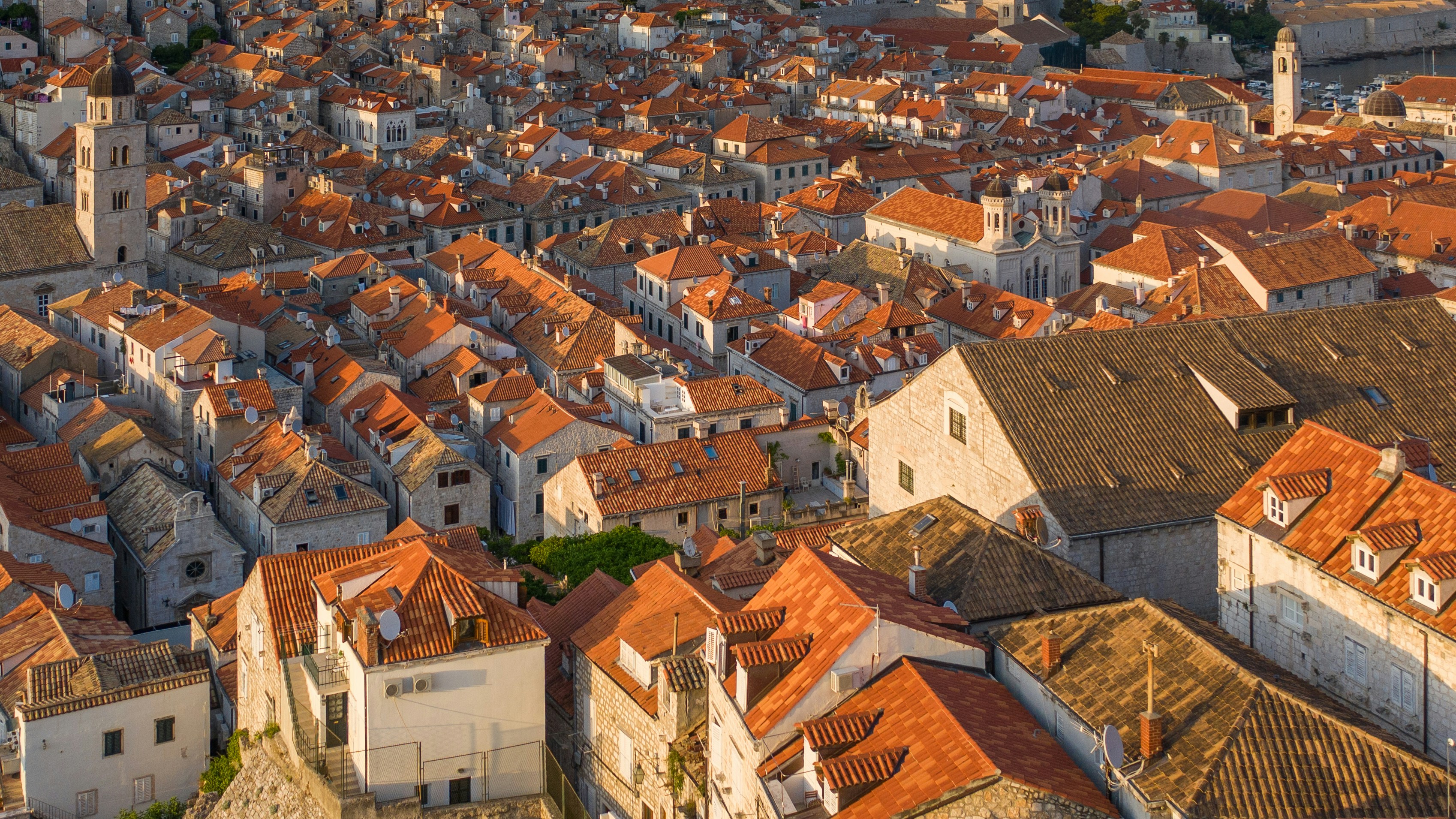 Aerial drone view of a residential gable roof at golden hour